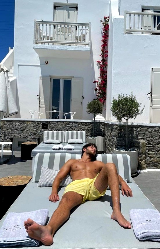 Eyal Booker barefoot & Shirtless on holiday sunbed